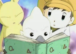 Neemon and Tommy look on as Bokomon looks up Agunimon in his book